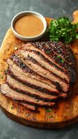 Tender slices of smoked brisket topped with fresh herbs, accompanied by a bowl of savory barbecue sauce, ideal for outdoor barbecues and family celebrations photo