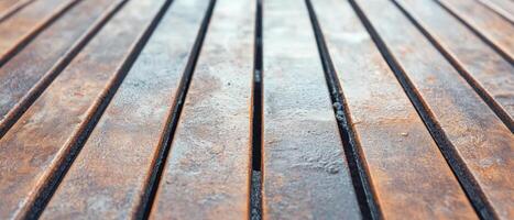 Close-up view of a rustic wooden barbecue grill featuring a smoky texture, perfect for summer cookouts and outdoor gatherings in a backyard atmosphere photo