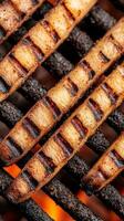 Perfectly grilled sausages showcase a beautiful char on the barbecue, bringing a smoky aroma to a lively summer gathering with friends and family photo