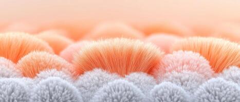 Colorful, fluffy brush fibers create a visually appealing abstract background, blending pastel tones of peach and gray for a serene atmosphere and artistic flair photo