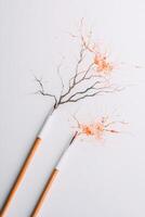 Artificial branches forming complex network shape. Orange powder explodes on light background. Neural network visualization. Network connectivity. Electronic circuit. photo