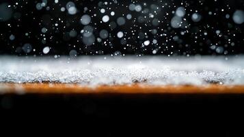 Snowflakes Falling on Surface with Bokeh Effect photo