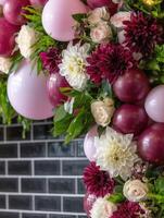 A balloon arch made of flowers and balloons photo