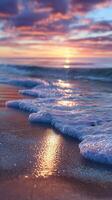 Serene sunset over calm waves on a tranquil beach shore photo