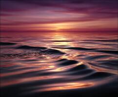 Calm waters reflecting a vibrant sunset near the ocean photo