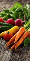 Fresh vegetables arranged on wooden table with vibrant colors photo