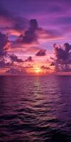 A purple sunset over the ocean photo