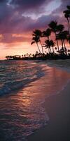 Sunsets glow over tranquil beach with palm trees swaying photo