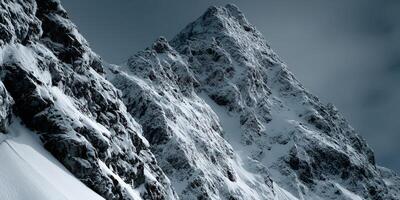 Majestic snow-covered mountain peak in winter landscape photo