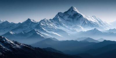 A mountain range with snow capped peaks photo