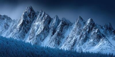 Snow-covered mountains under a dramatic dark sky at dusk photo