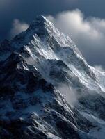 Majestic snow-covered mountain peak under cloudy sky photo
