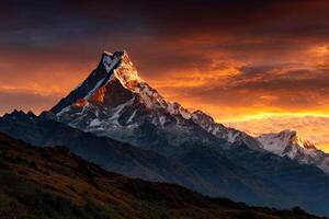 Mountain peak glows at sunset in the Himalayas photo