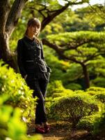 Serenity in nature with a young woman in a lush garden photo