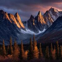 Majestic mountain peaks illuminated by sunset in rugged wilderness photo