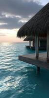 un agua villa con tejado de paja techo terminado el Oceano foto