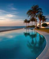 Serene sunset view over tranquil poolside landscape with palm trees photo