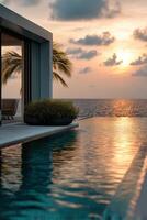 Luxury beachfront villa with sunset view and serene infinity pool photo