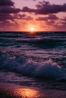 Sunset over ocean waves at a beach with colorful clouds in the sky photo