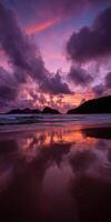 Sunset over tranquil beach showcasing colorful clouds and reflections photo
