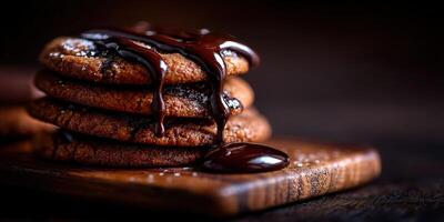 Warm cookies topped with melted chocolate on a wooden surface in a cozy kitchen photo