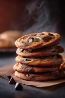 Warm chocolate chip cookies stacked on parchment paper with steam rising photo