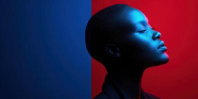 Portrait of a person illuminated by blue and red lighting with a serene expression photo