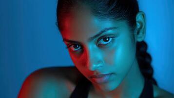 Captivating portrait of a young person with blue and red lighting photo