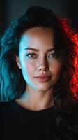 Captivating portrait of a woman with curly hair in dramatic lighting photo