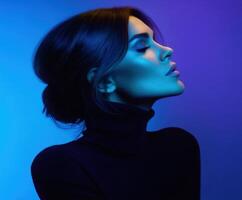 Elegant profile of a woman in stylish attire with vibrant lighting effects photo