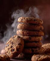 Warm homemade cookies stacked high with steam rising in a cozy setting photo