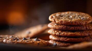 Freshly baked chocolate chip cookies stacked on a rustic table photo