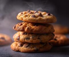 Freshly baked chocolate chip cookies stacked high on a table photo