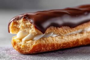 Delicious chocolate eclair with creamy filling ready to enjoy photo