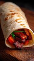 Delicious taco wrap with grilled meat and fresh vegetables at a local market photo