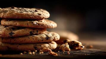 A stack of chocolate chip cookies on a wooden table photo