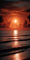 Beautiful sunset over ocean waves with deep orange and purple sky reflections photo