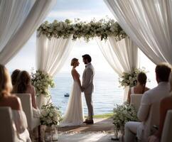 Couple exchanging vows at a beautiful seaside wedding venue photo
