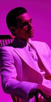 Stylish man in elegant suit poses against vibrant backdrop photo
