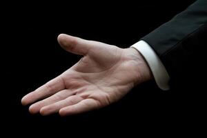 Elegant male hand reaching out against a dark background, symbolizing invitation and connection photo