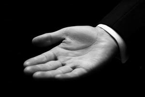 Elegant hand gesture in a formal setting, showcasing readiness for interaction photo