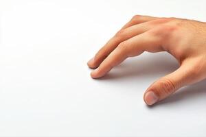 Close-up of a human hand reaching out towards a blank surface, symbolizing curiosity photo