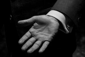 Elegant black and white image of a hand reaching out, showcasing sophistication and style photo