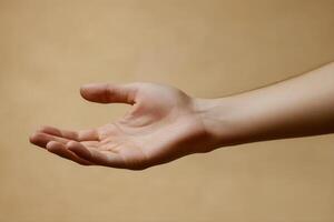 A close-up of an outstretched human hand against a soft, neutral background photo