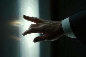 Elegant hand reaching towards a glowing interface in a modern, high-tech environment photo