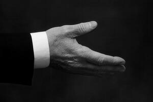 Elegant black and white image of a hand reaching out, symbolizing invitation or connection photo