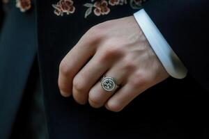 Elegant close-up of a man's hand wearing a stylish ring, showcasing intricate details photo