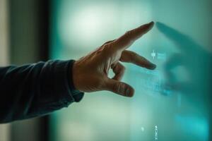 Close-up of a person's hand interacting with a digital touchscreen interface in a modern setting photo