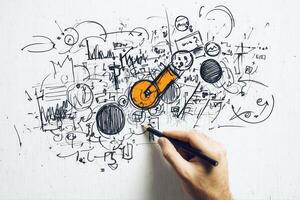 Creative hand sketching abstract designs on a whiteboard with vibrant colors and doodles photo
