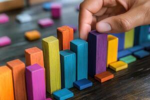 Colorful wooden blocks arranged in a bar graph, showcasing data analysis in a bright workspace photo